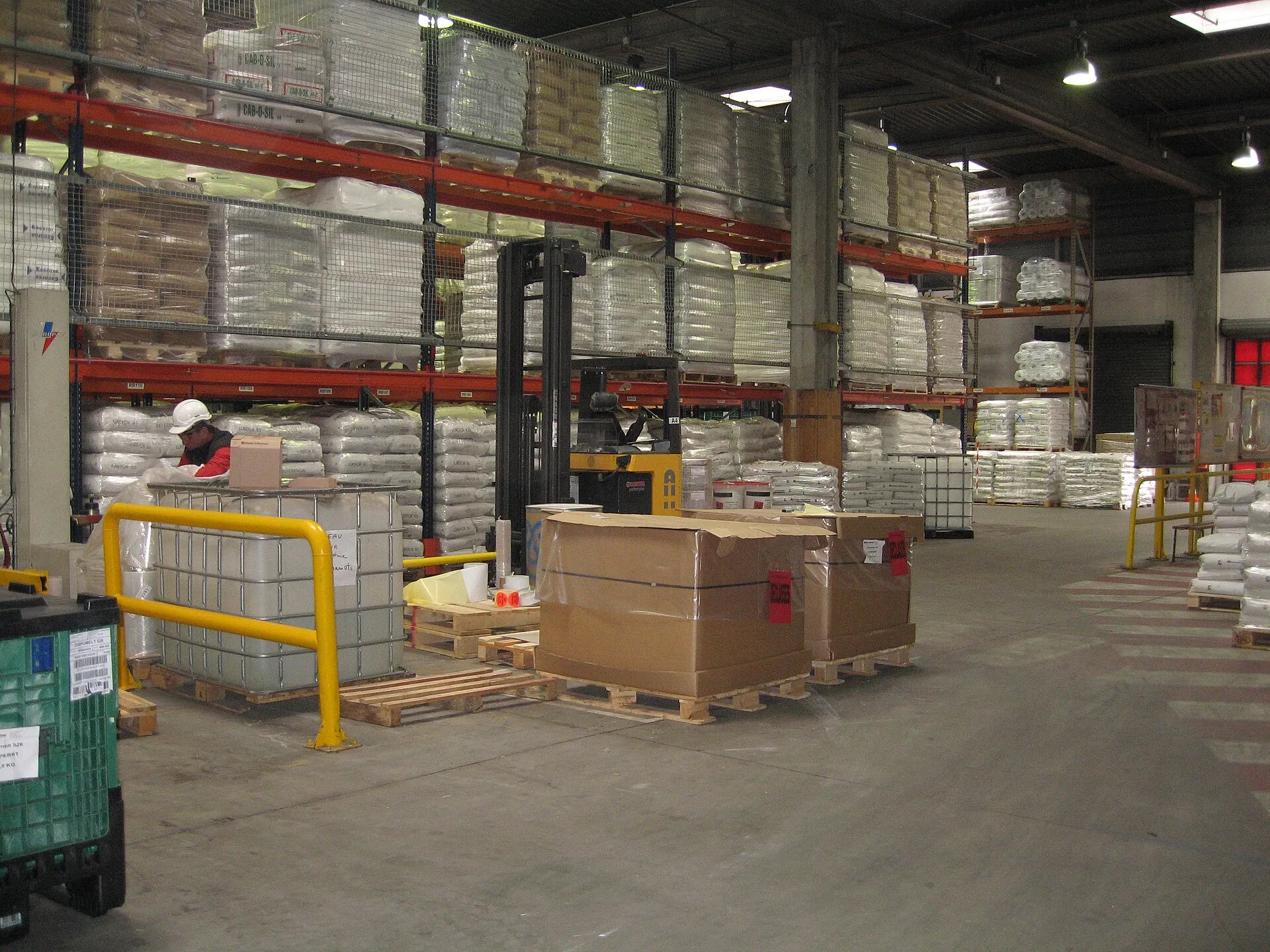 Polymer goods stacked in an industrial warehouse